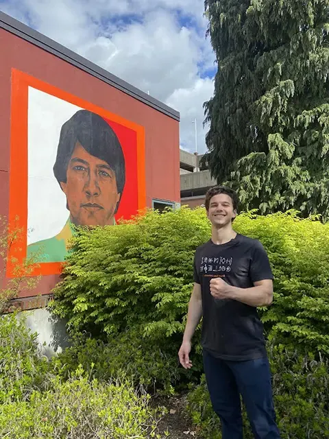 Lorenzo Curtis standing in front of the Centro Cultural César Chávez